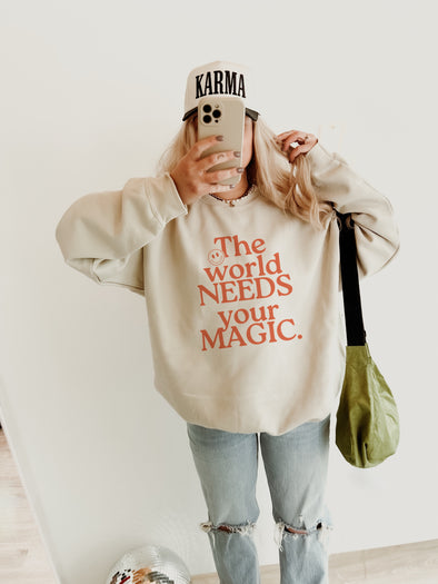 THE WORLD NEEDS YOUR MAGIC CREWNECK