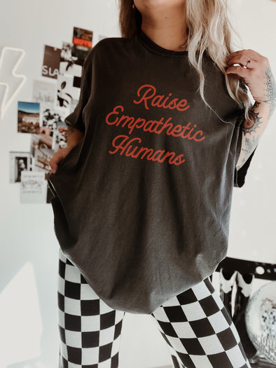 RAISE EMPATHETIC HUMANS TEE