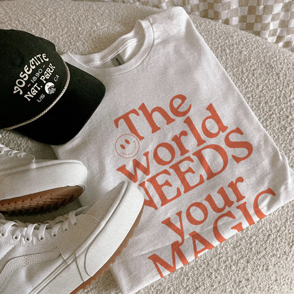 THE WORLD NEEDS YOUR MAGIC TEE